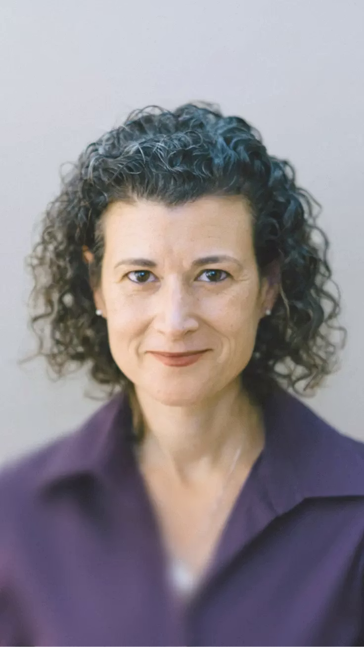 Portrait of a woman indoors next to a testimonial about Mercury’s built-in permissions.